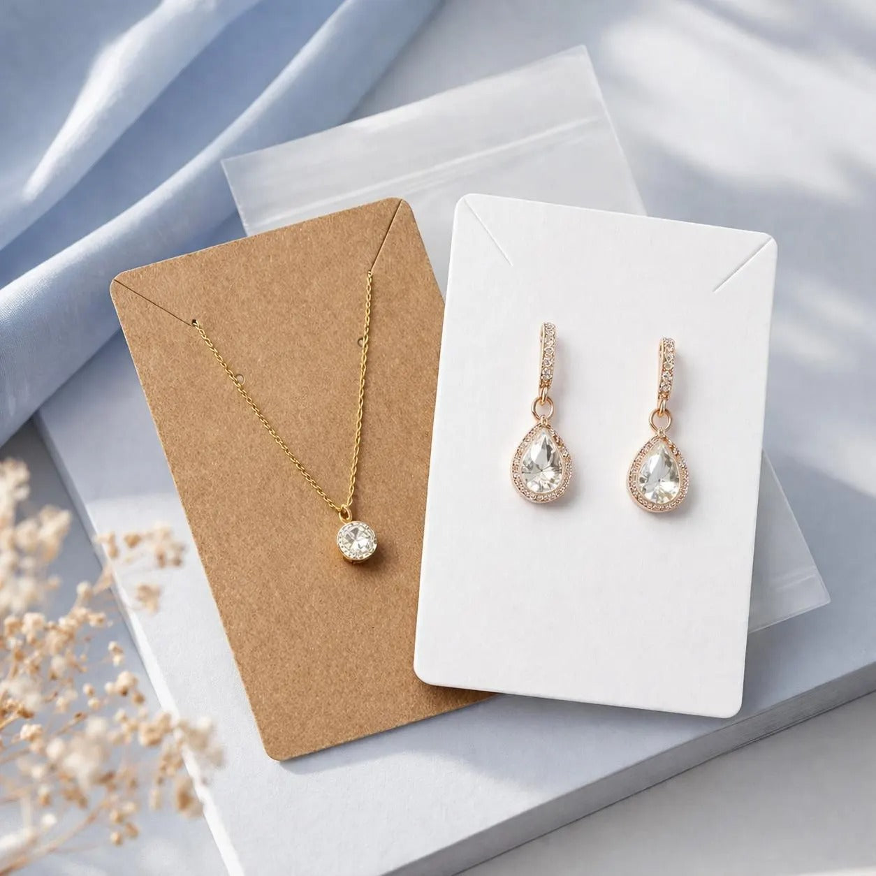 selection of jewellery display cards in brown, white, black and grey  white marble