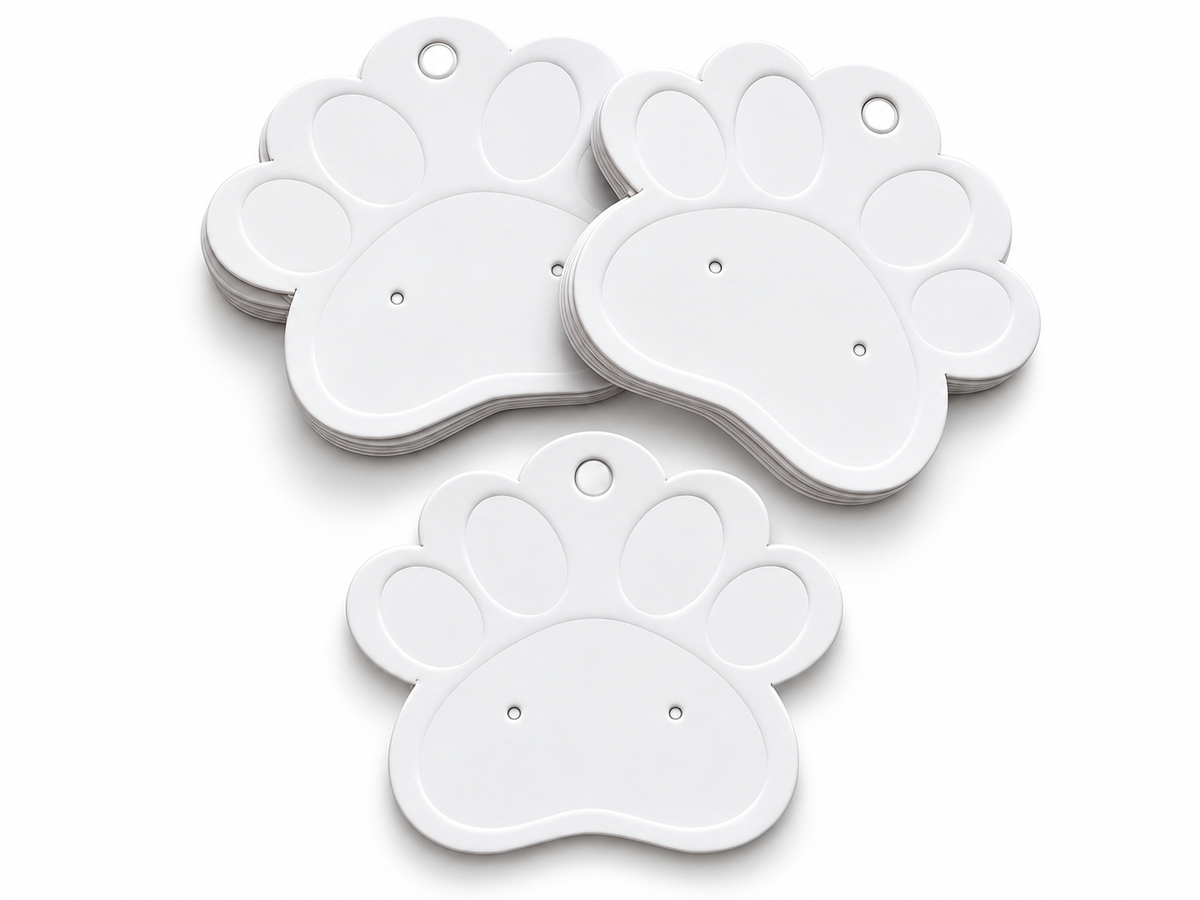Three white paw-shaped earring display cards with hanging holes, arranged on a clean white background.
